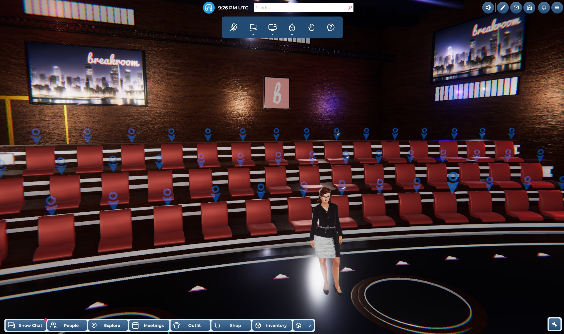 A screenshot of a gray-haired female avatar looking up the stadium seating in an empty auditorium. Blue circle and arrow tags hover over the available seats.